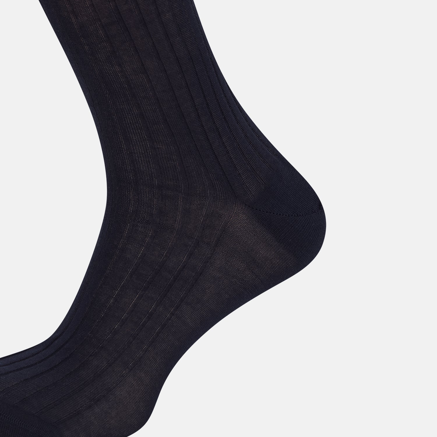 View 4 of product A single navy long sock by Turnbull & Asser, featuring a subtle ribbed texture and crafted from soft Egyptian cotton, displayed on a plain white background.