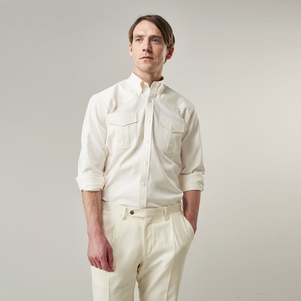 The Cream Cotton Weekend Fit Western Shirt with Dorset Collar by Turnbull & Asser features two chest pockets and is laid flat on a white background—ideal for smart-casual style.