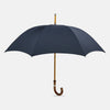 View 1 of product The Turnbull & Asser Navy Traveller Umbrella features a Malacca crook handle and is shown open against a plain white background.