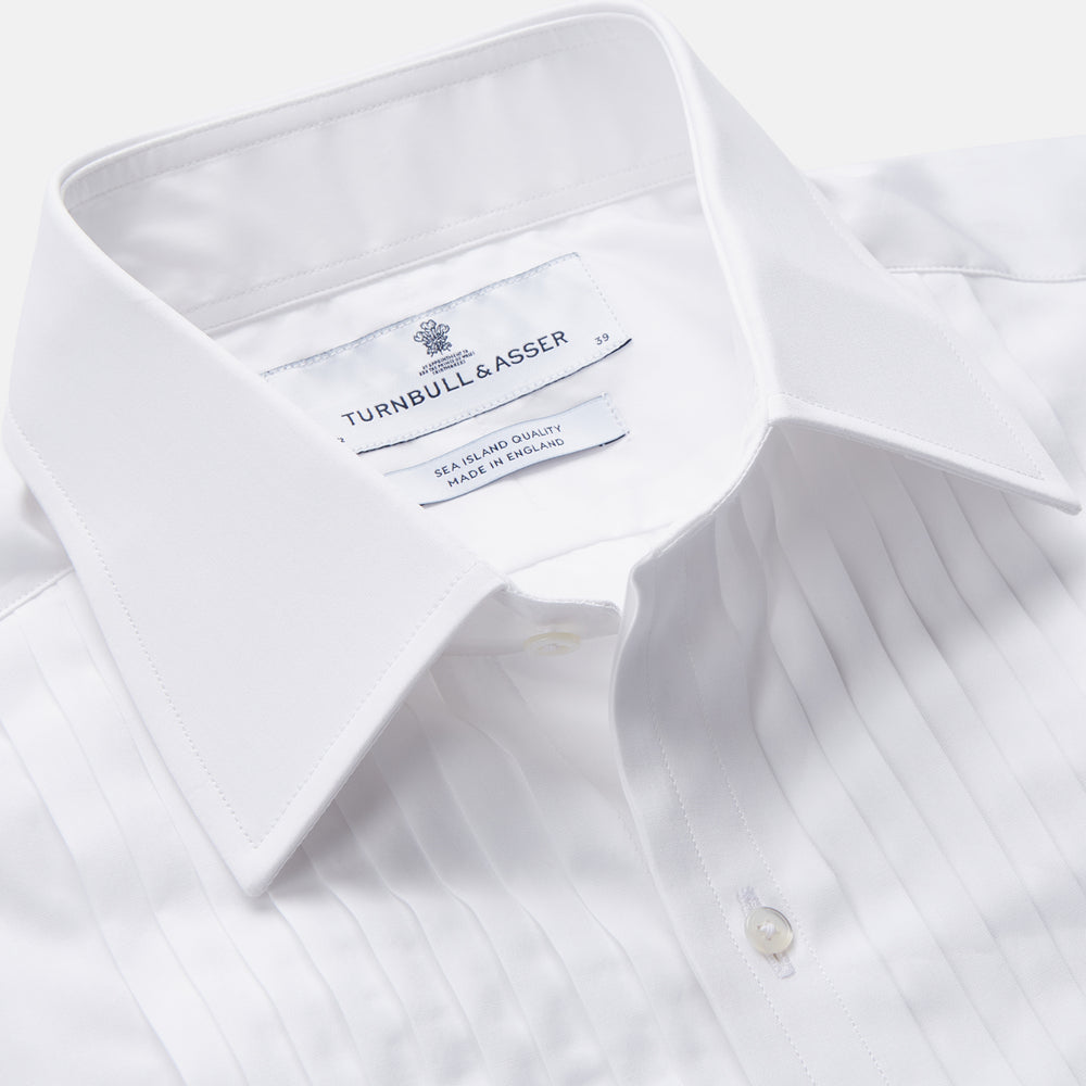 The Turnbull & Asser White Pleated Cotton Dress Shirt features a T&A collar and double cuffs, shown laid flat on a white background.