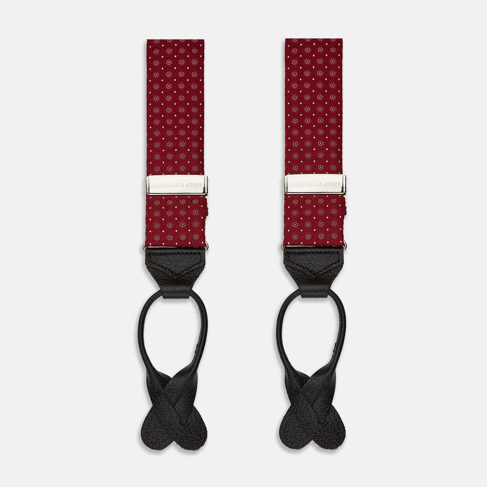 The Turnbull & Asser Burgundy Assorted Braces feature small white dots, silver adjusters, and black leather loops—a timeless accessory for the traditional gentleman.