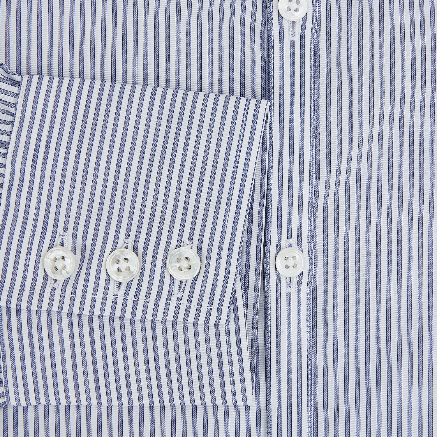 View 4 of product The Turnbull & Asser Navy and White Stripe Westminster Shirt features thin vertical stripes, a Turnbull collar, long sleeves, and classic British craftsmanship, shown flat on a white background.