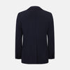 View 3 of product The Navy Knitted Oxford Blazer by Turnbull & Asser features notch lapels, two front buttons, a chest pocket, and two lower patch pockets, shown against a plain white background.