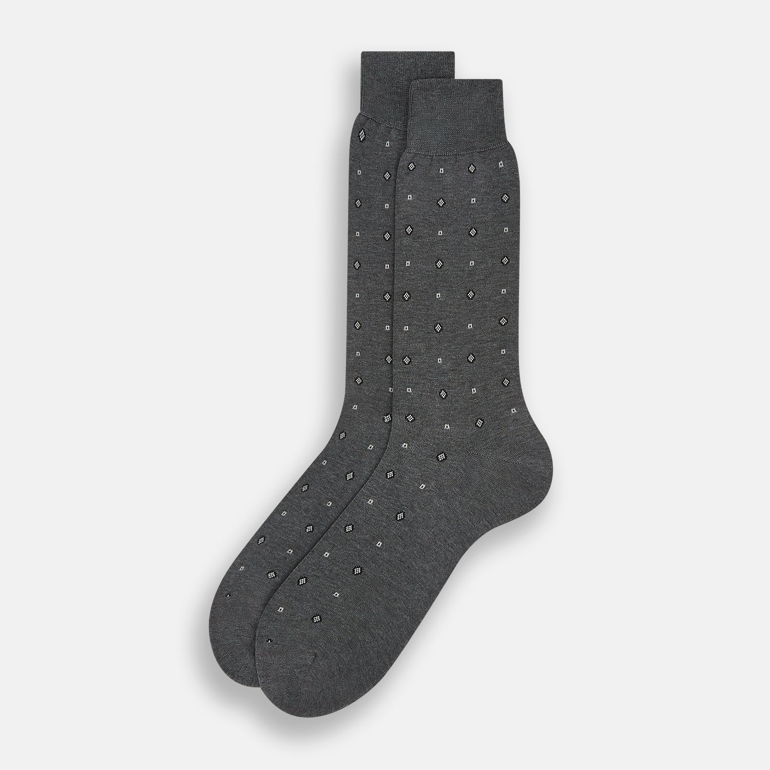 View 2 of product The Grey Patterned Mid-Length Socks by Turnbull & Asser are crafted from soft Egyptian cotton, with a ribbed cuff and small white diamond shapes on a grey background.