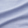 View 5 of product The Turnbull & Asser Pale Blue Weekend Fit Hayne Shirt features a Dorset collar, white buttons, and 1-button cuffs. This casual, long-sleeve button-down is displayed laid flat on a white background.