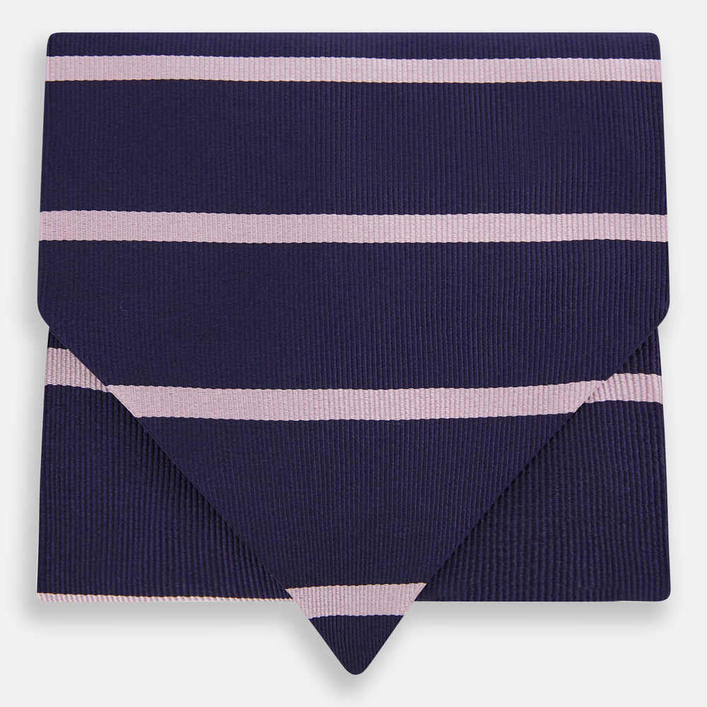 The Turnbull & Asser Pink Stripe and Navy Silk Cravat features evenly spaced light pink stripes on navy silk—a refined British style wedding accessory, elegantly displayed against a white background.