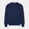 View 1 of product The Turnbull & Asser Navy Merino Round Neck Jumper is shown against a light gray background, featuring a classic long-sleeve design with ribbed cuffs, hem, and neckline for timeless style.