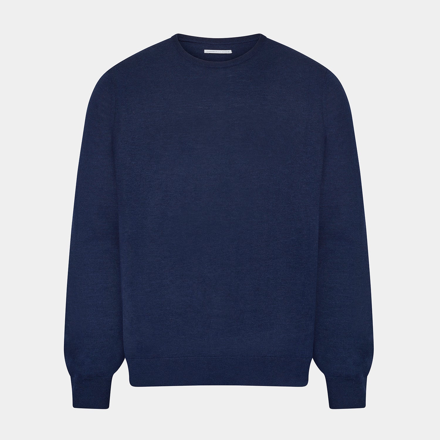 View 1 of product The Turnbull & Asser Navy Merino Round Neck Jumper is shown against a light gray background, featuring a classic long-sleeve design with ribbed cuffs, hem, and neckline for timeless style.