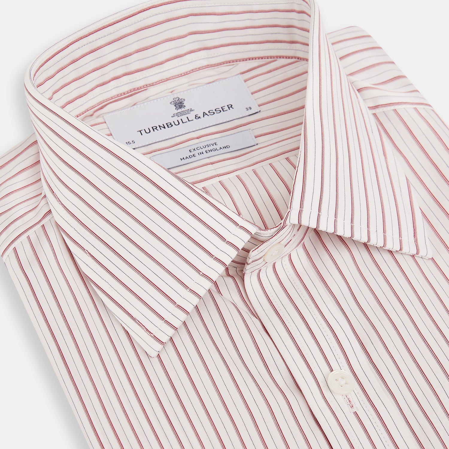 View 2 of product The Red Multi Ticking Stripe Mayfair Shirt by Turnbull & Asser features thin red and blue vertical stripes on white, a T&A collar, long sleeves, and button-up design.