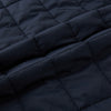 View 4 of product The Turnbull & Asser Navy Quilted Gilet is sleeveless and lightweight, with a front zipper, zippered side pockets, chest pocket, and rounded hem—ideal for versatile layering. Shown on a plain white background.