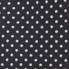 View 3 of product The Turnbull & Asser Black and White Spot Printed Silk Tie, shown neatly rolled on a plain white background, is an essential accessory to elevate any smart attire.