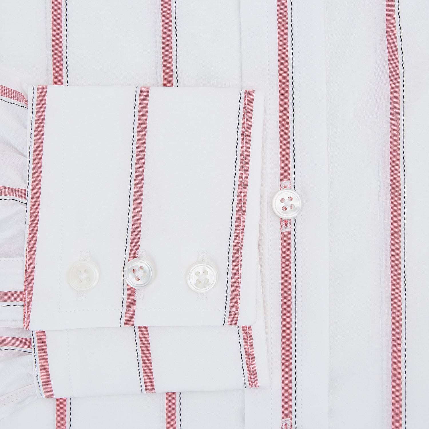 View 4 of product The Turnbull & Asser Coral Track Stripe Mayfair Shirt features a white Italian cotton fabric with vertical red stripes and a pointed T&A collar, shown against a plain light background.