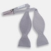 View 2 of product The Turnbull & Asser Silver and White Square Silk Bow Tie features a subtle geometric pattern, ideal for formalwear, and is displayed against a plain white background.