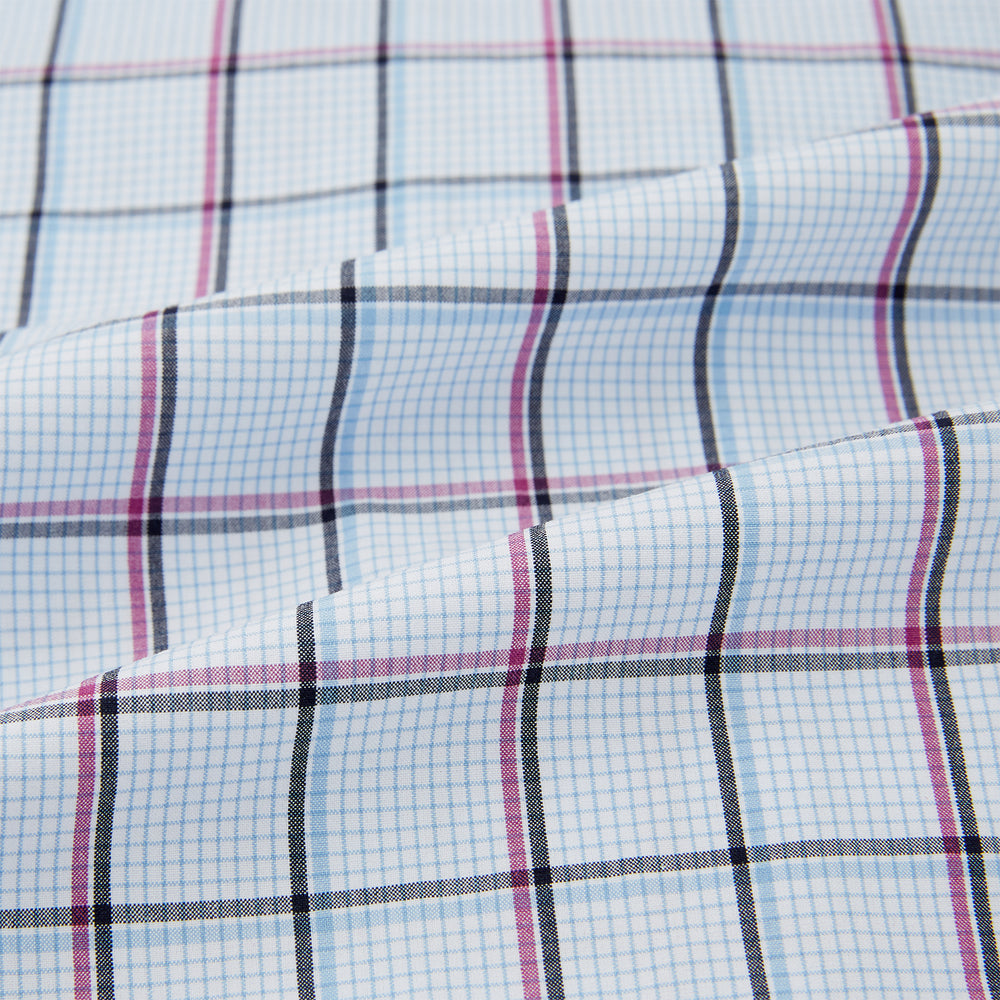 The Turnbull & Asser Burgundy and Blue Check Pyjama Shirt features a classic collar, button-up front, and grid check pattern—an elegant choice for nightwear or comfortable sleepwear.
