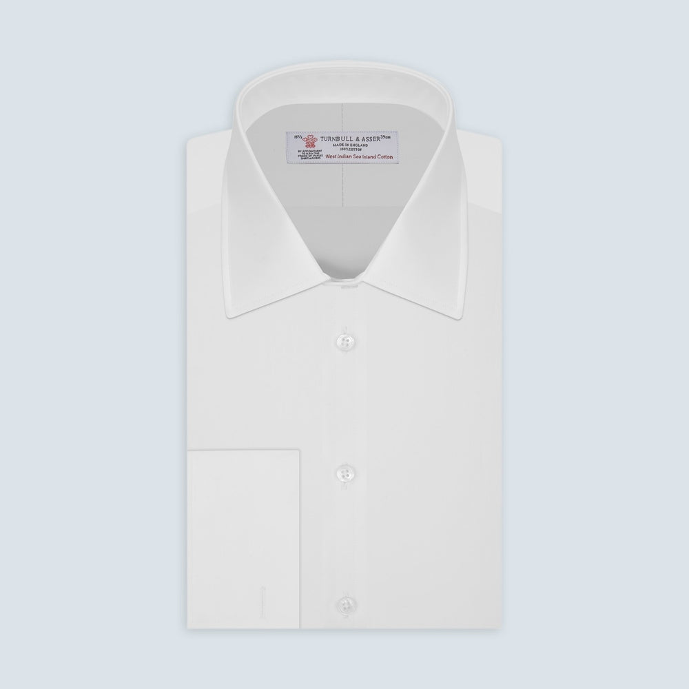 A centered white circle with a thin gray border on a light gray background represents Turnbull & Asser's White West Indian Sea Island Cotton Fabric, highlighting its pure, unadorned elegance and premium quality.