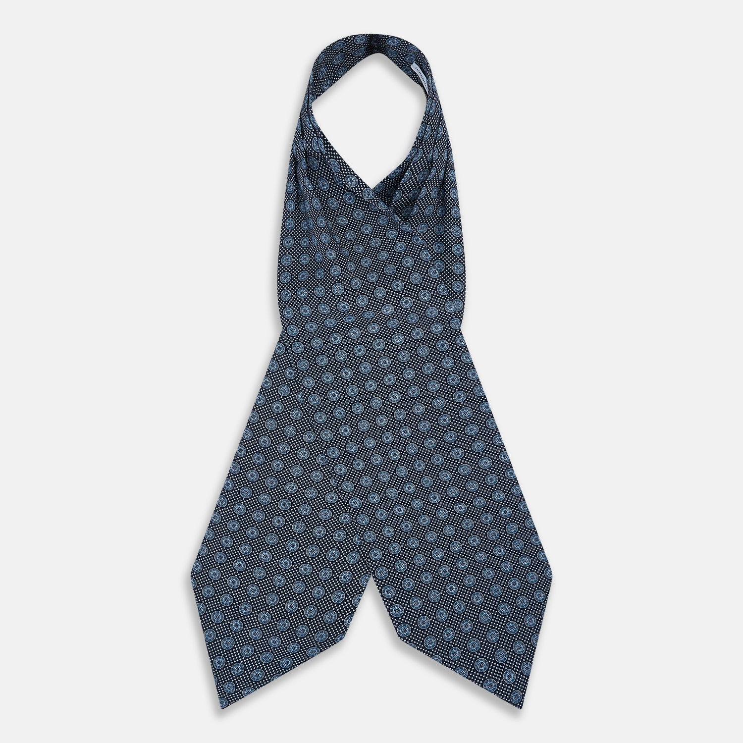 View 2 of product The Turnbull & Asser Navy Medallion Silk Cravat features a white geometric and circular pattern, its classic design and rich navy hue echoing refined British elegance.
