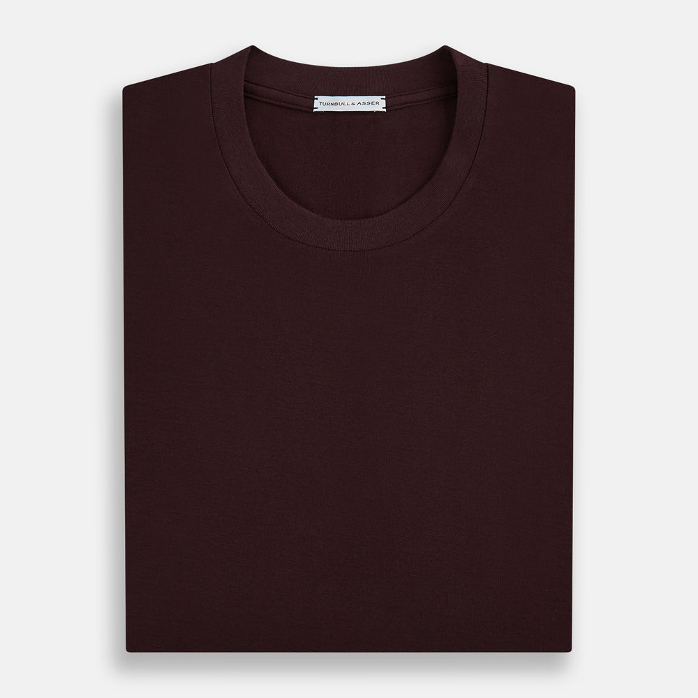 The Turnbull & Asser Burgundy Short-Sleeve T-shirt, featuring a crew neckline and clean design with no visible logos, is shown against a white background for a timeless and versatile look.