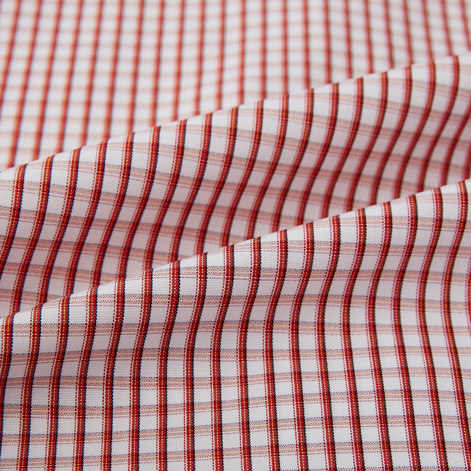 View 4 of product The Turnbull & Asser Red Micro Shadow Check Mayfair Shirt, made from premium Italian cotton with a classic collar and buttoned cuffs, is shown on a plain white background.