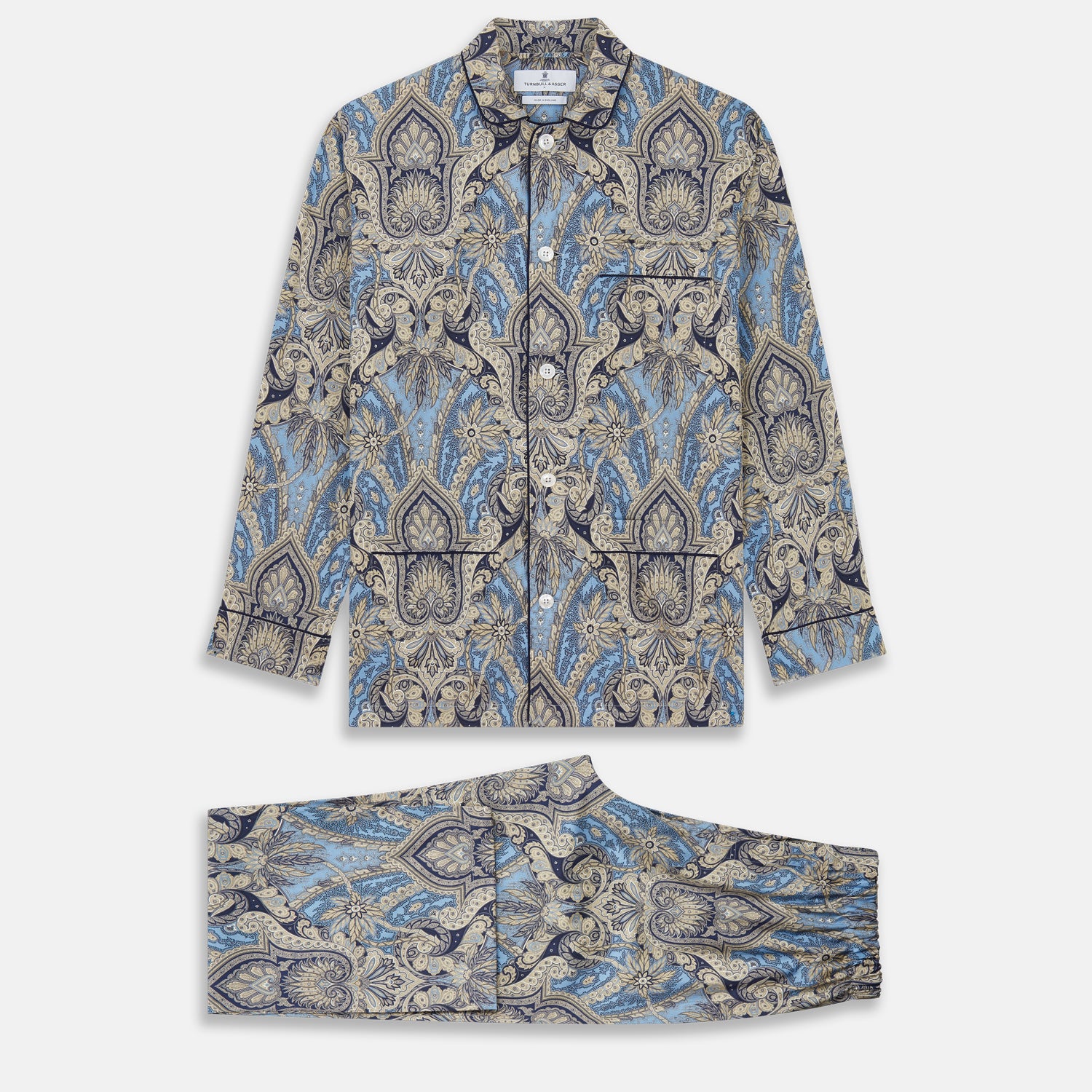 View 1 of product The Turnbull & Asser Pale Blue Baroque Silk-blend Hyde Pyjama Set features a long-sleeve button-up shirt and pants in a blue and beige paisley pattern, shown flat on a white background.