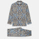 The Turnbull & Asser Pale Blue Baroque Silk-blend Hyde Pyjama Set features a long-sleeve button-up shirt and pants in a blue and beige paisley pattern, shown flat on a white background.