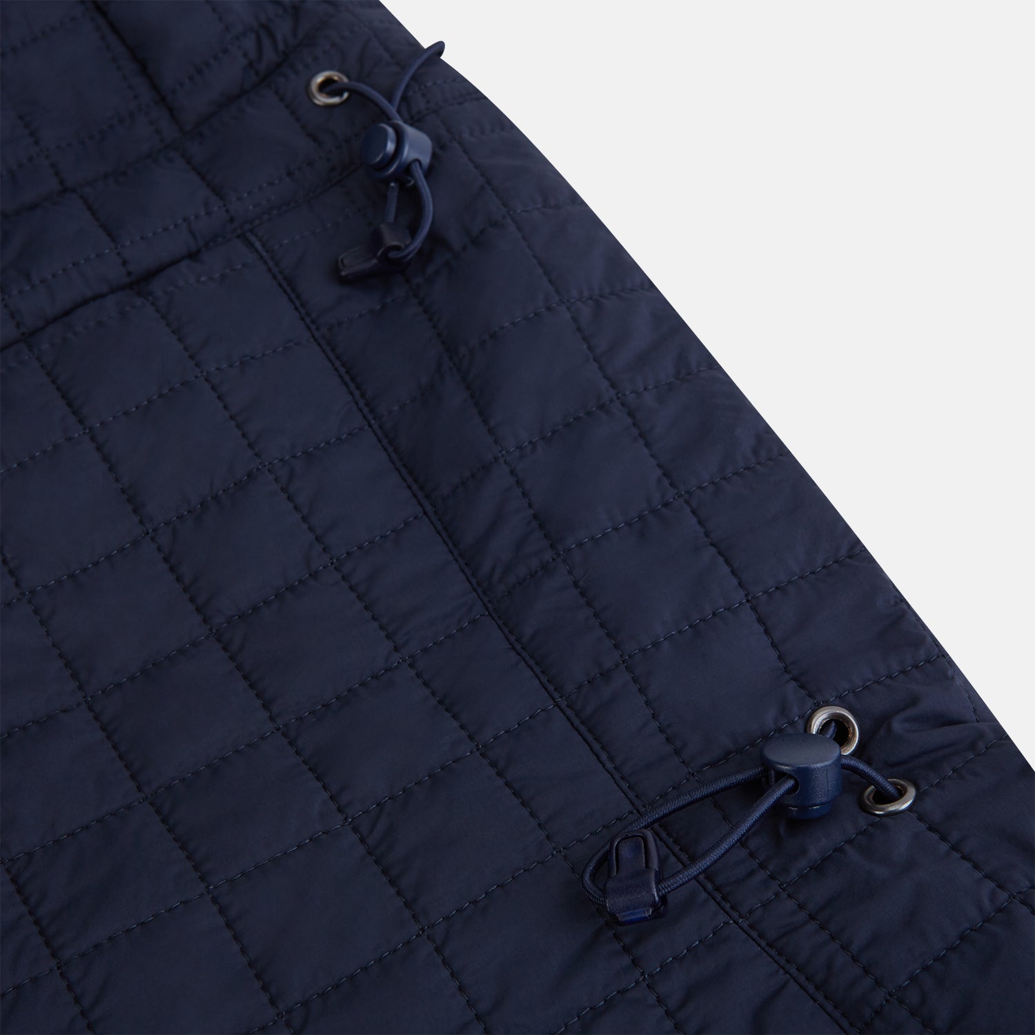 View 6 of product The Turnbull & Asser Navy Quilted Hood with Neck Warmer features diamond pattern stitching, a structured hood, overlapping collar, and button closure, shown on a plain white background.