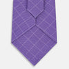 View 3 of product The Turnbull & Asser Purple Dotted Check Pattern Printed Silk Tie is displayed rolled up on a white background, featuring a subtle check design for an elegant look.