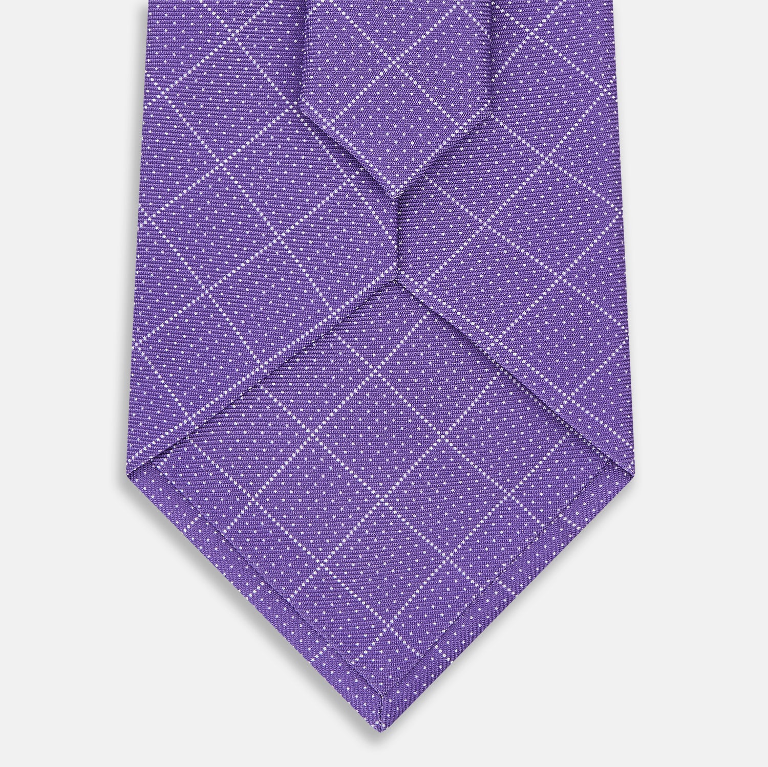 View 3 of product The Turnbull & Asser Purple Dotted Check Pattern Printed Silk Tie is displayed rolled up on a white background, featuring a subtle check design for an elegant look.