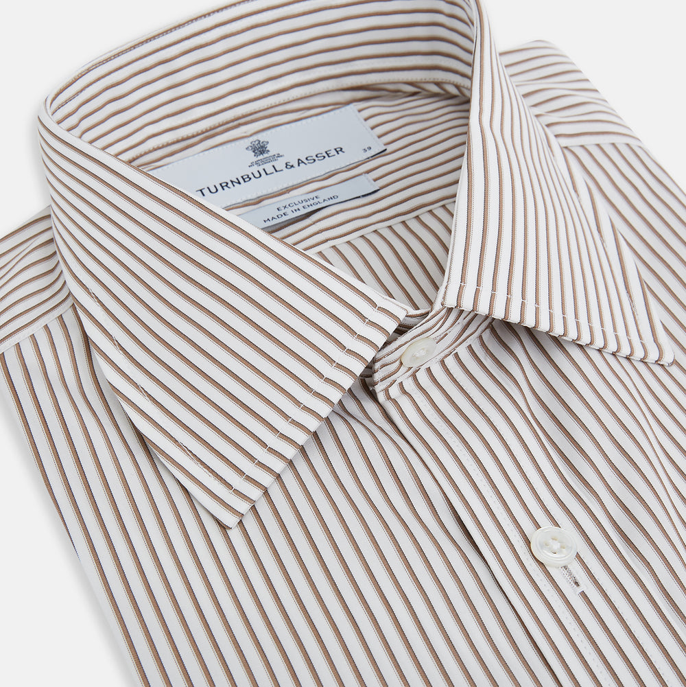 The Coffee Shadow Stripe Mayfair Shirt by Turnbull & Asser is a long-sleeve, button-down style with a T&A collar and fine beige and white stripes, crafted from premium Italian cotton and shown on a white background.