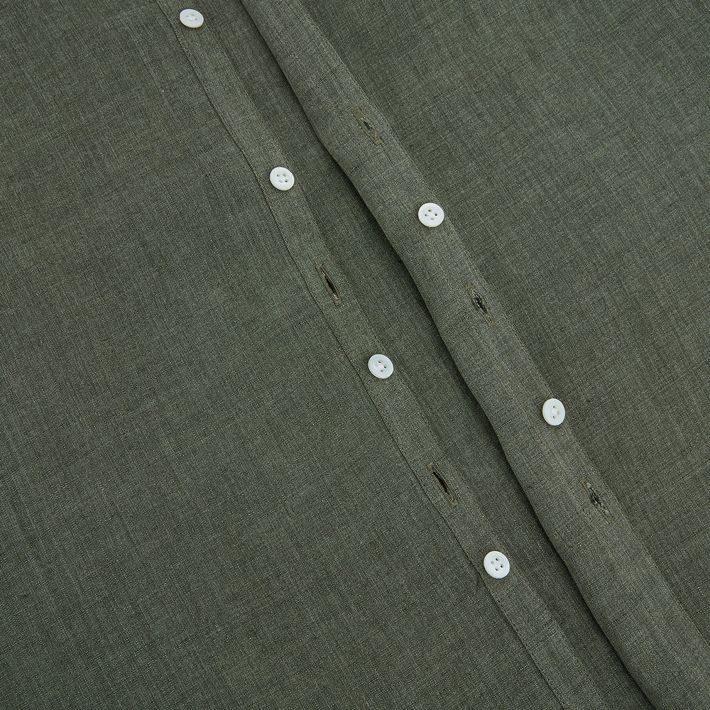 The Sage Linen Westminster Shirt by Turnbull & Asser features long sleeves, a button-up front with white buttons, a pointed Turnbull collar, and buttoned cuffs—crafted in Britain and shown here against a plain white background.