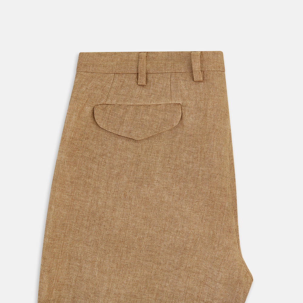 The Turnbull & Asser Camel Striped Linen Edmund trousers feature a straight-leg fit, button and zipper closure, belt loops, and pockets, crafted from lightweight summer fabric and shown against a white background.