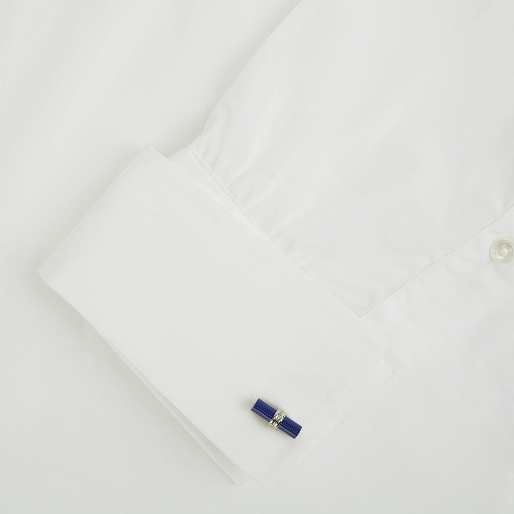 Turnbull & Asser’s Lapis Lazuli Handlebar Cufflinks feature sterling silver with cylindrical lapis lazuli bars, shown on a white background.