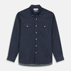 View 1 of product The Turnbull & Asser Navy Weekend Fit Larkin Shirt features a Dorset collar, long sleeves with 3-button cuffs, two chest pockets, and white snaps, shown laid flat against a white background.