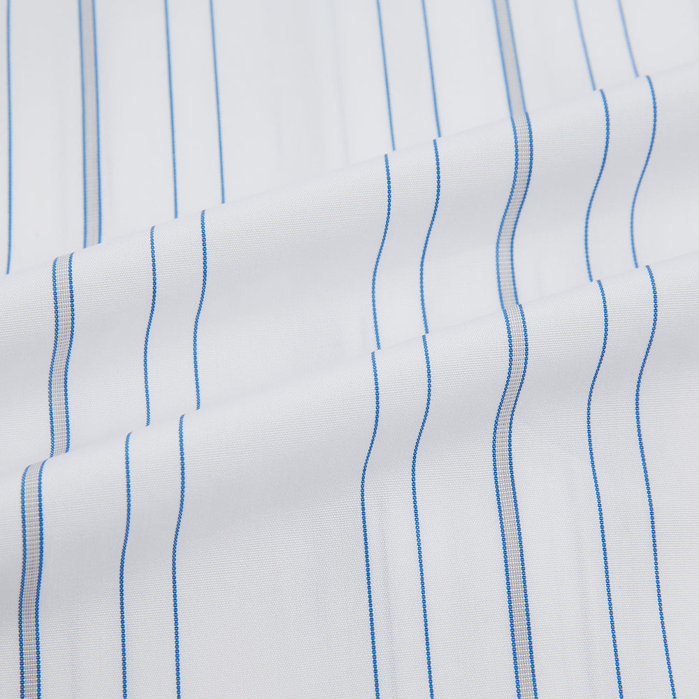 The Turnbull & Asser Pale Blue Multi Stripe Mayfair Shirt, featuring long sleeves, a classic collar, and buttoned cuffs, exemplifies British craftsmanship and is shown flat on a white background for a crisp look.