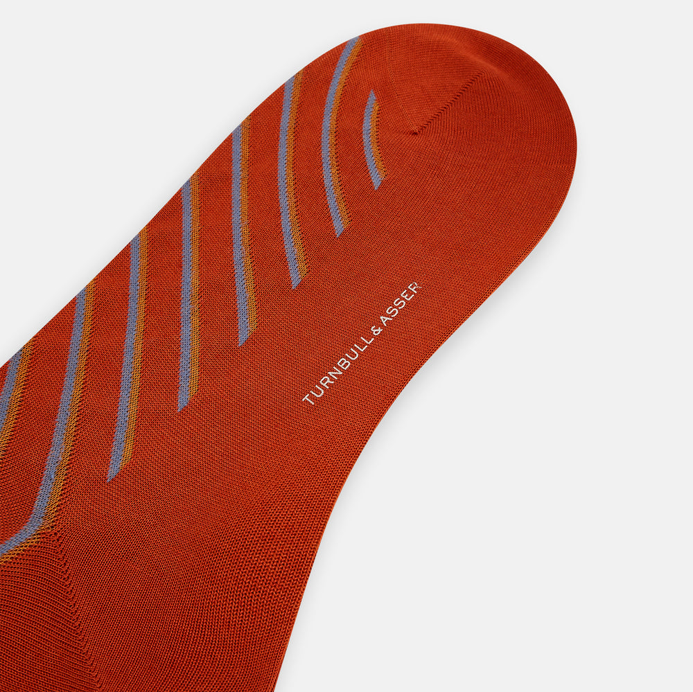 Turnbull & Asser Rust/orange/blue Diagonal Striped Long Sock shown knee-high and single on a white background.
