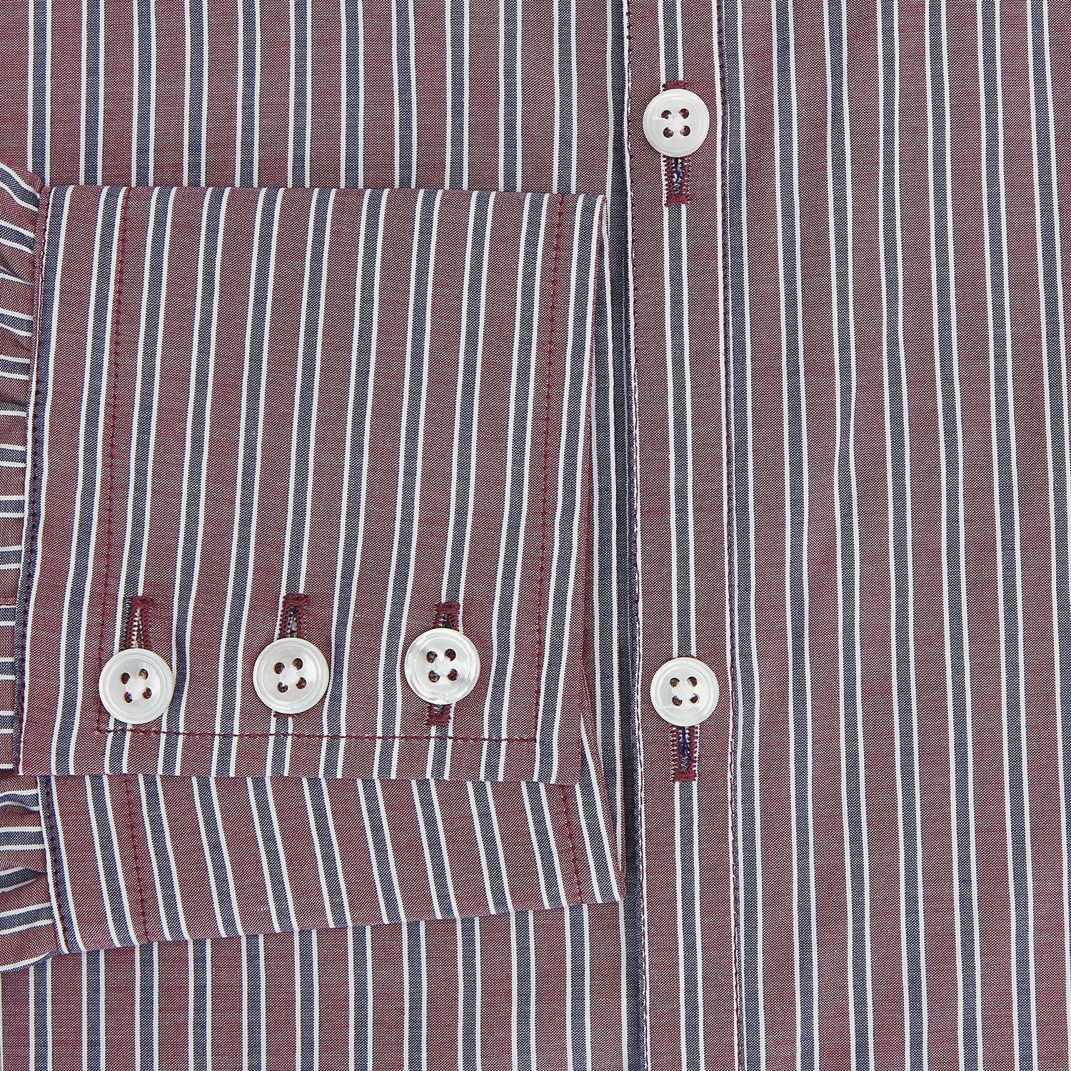 View 4 of product The Turnbull & Asser Wine Ticking Stripe Westminster Shirt features red, blue, and white vertical pinstripes on white and is shown laid flat on a white surface.