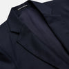 View 2 of product The Turnbull & Asser Navy Plain Wool Single Breasted Blazer features gold buttons, a notched lapel, and multiple pockets, and is shown against a white background.