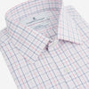 View 2 of product The Turnbull & Asser Pink Overlay Grid Check Mayfair Shirt is a long-sleeved, button-up with a collar and buttoned cuffs, featuring a white base and thin pink grid lines. Laid flat against a white surface.