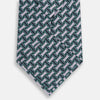 View 3 of product The Turnbull & Asser Lilac and Kelly Weave Patterned Silk Tie, rolled up, showcases a geometric design in lilac and green tones against a plain white background.