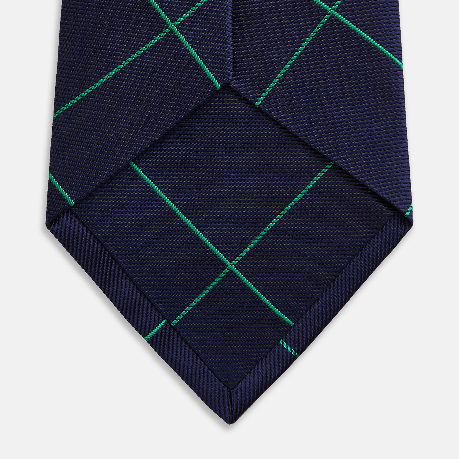 View 4 of product The Turnbull & Asser Green and Navy Window Pane Silk Tie features a subtle ribbed texture with a diagonal green grid pattern, inspired by archival designs—a stylish choice for modern office attire.