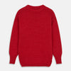 View 1 of product The Red Lewis Guernsey Knitted Jumper by Turnbull & Asser is a bright red wool-cotton, long-sleeve jumper with a round neckline, ribbed cuffs, and ribbed hem, shown against a white background.