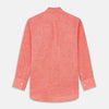 View 5 of product The Turnbull & Asser Pink Linen Weekend Fit Hayne Shirt is a casual, long-sleeve button-down with a subtle texture and white buttons, neatly laid flat on a white background.