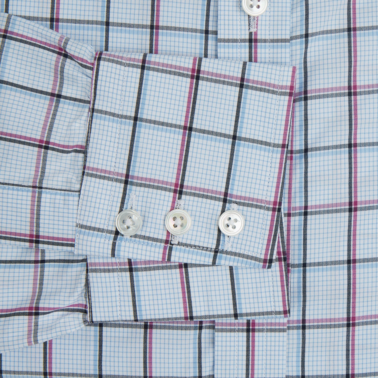 View 3 of product The Turnbull & Asser Blue and Pink Tattersall Check Mayfair Shirt features a classic tattersall pattern with a T&A collar and cuffed sleeves.