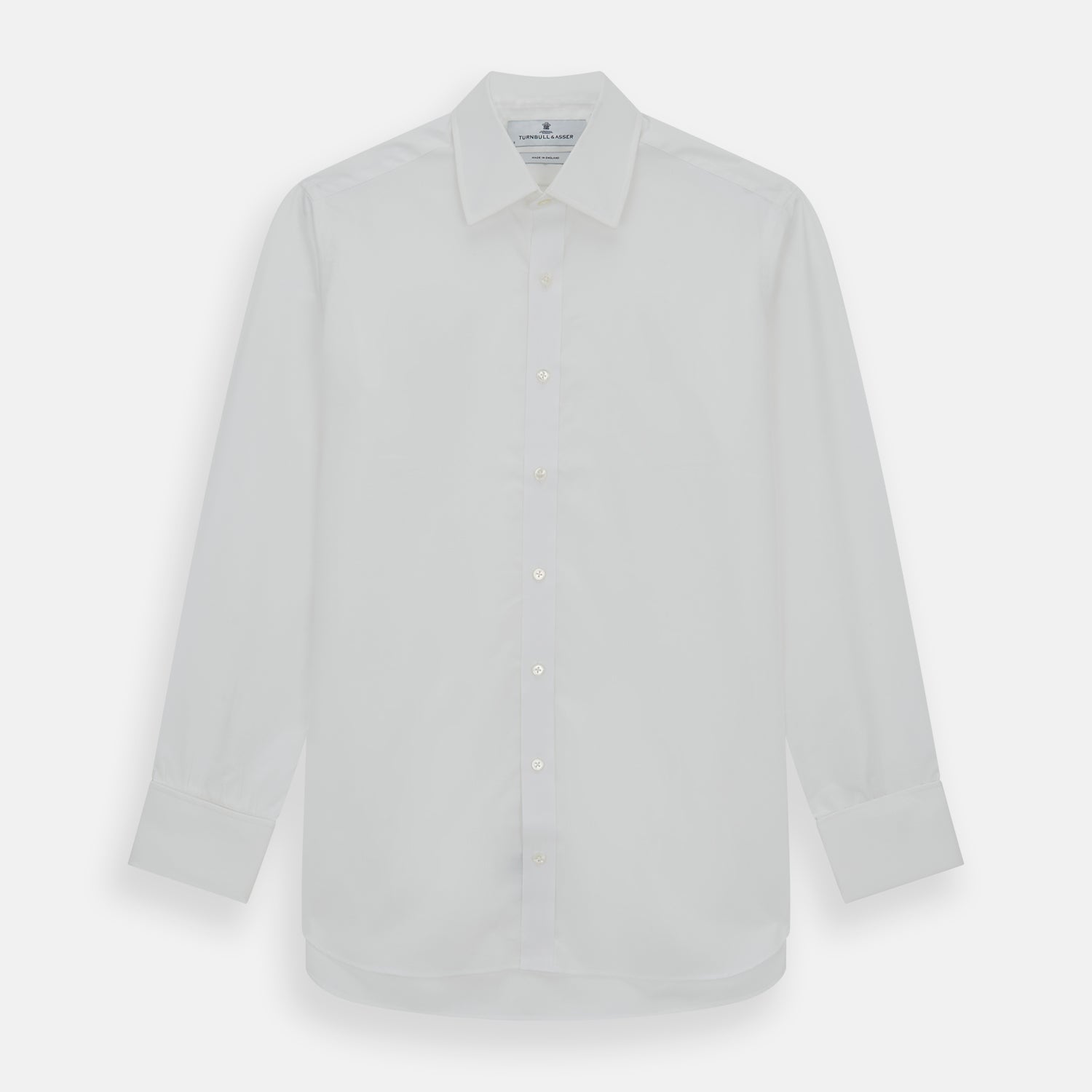 View 1 of product The Turnbull & Asser Plain White Cotton Shirt features a T&A collar and double cuffs, shown flat on a white background—ideal for pairing with standout ties or achieving a minimalist look.