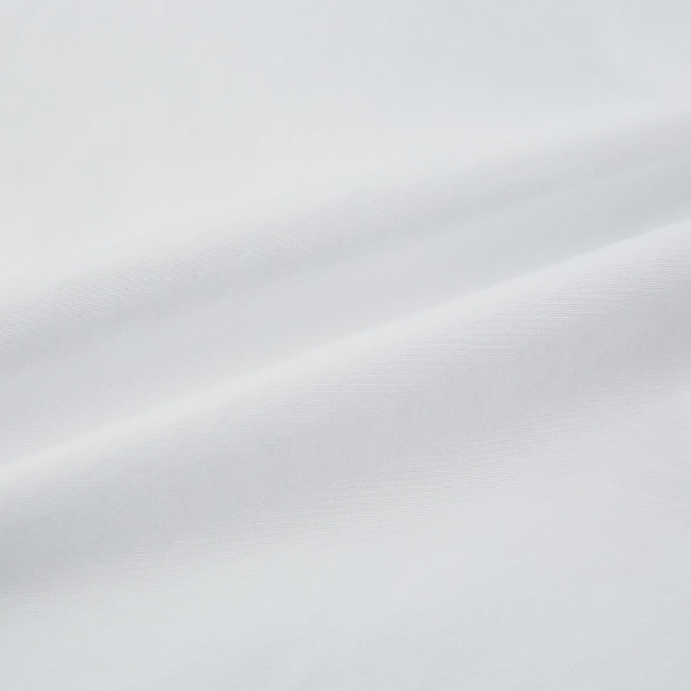 The White Hyde Overshirt by Turnbull & Asser is crafted from sanforised cotton with a left chest pocket and dark buttons—offering a sharp, casual blazer alternative. Shown laid flat on a white background.