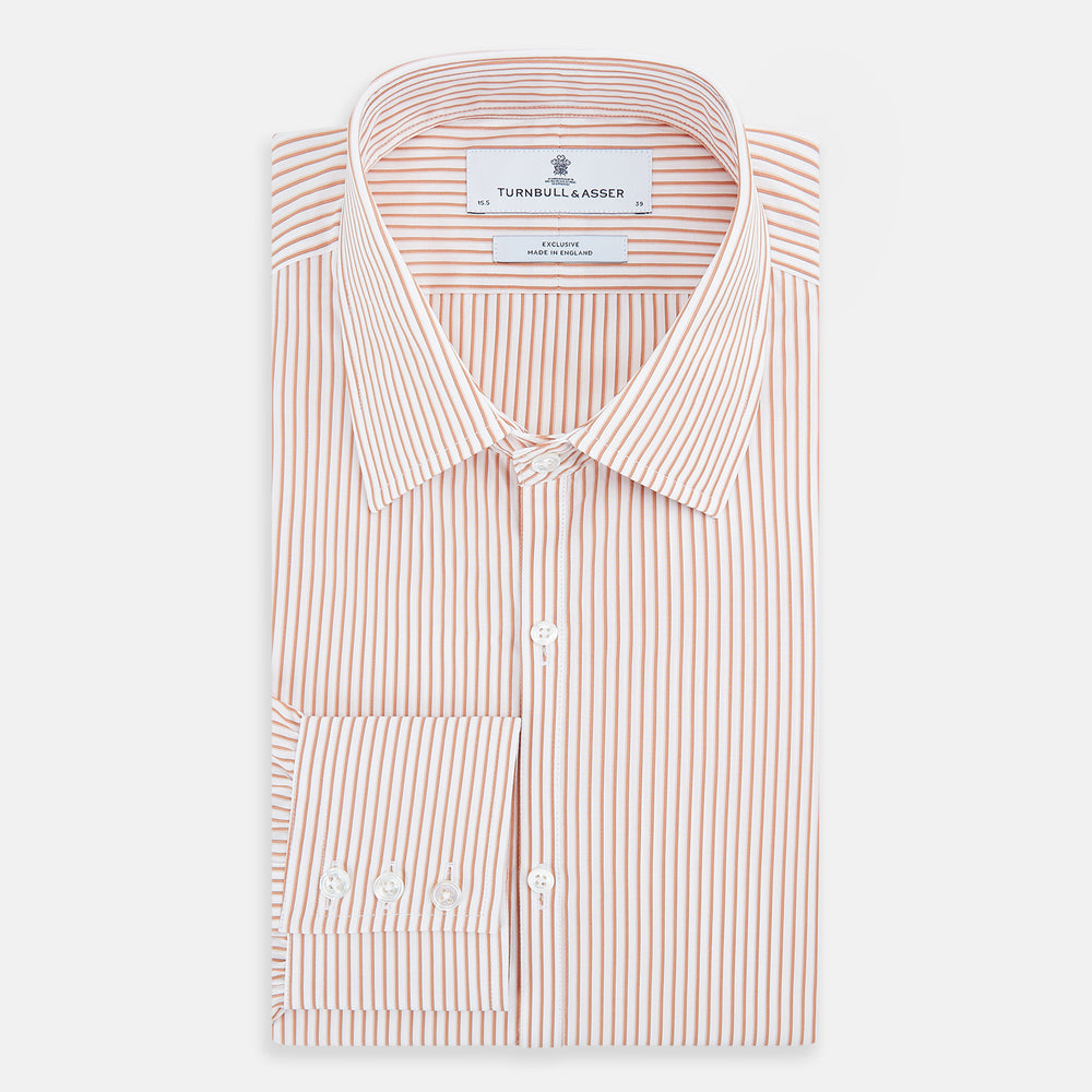 The Orange Multi Stripe Westminster Shirt by Turnbull & Asser features thin vertical orange and white stripes, a Turnbull collar, and long sleeves, elegantly displayed flat against a white background.