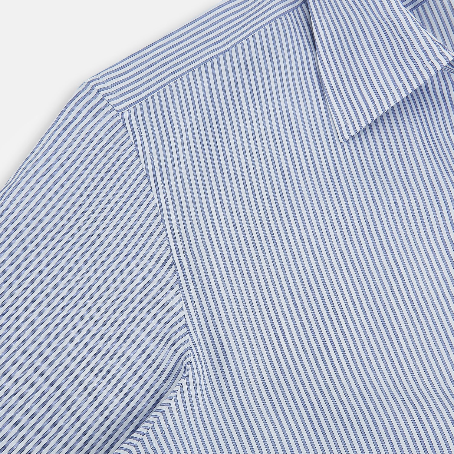 View 5 of product The Turnbull & Asser Navy and White Stripe Westminster Shirt features thin vertical stripes, a Turnbull collar, long sleeves, and classic British craftsmanship, shown flat on a white background.