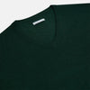 View 2 of product The Turnbull & Asser Petrol Green Merino V-Neck Jumper features long sleeves and ribbed cuffs and hem—an essential knitwear piece, shown against a white background.