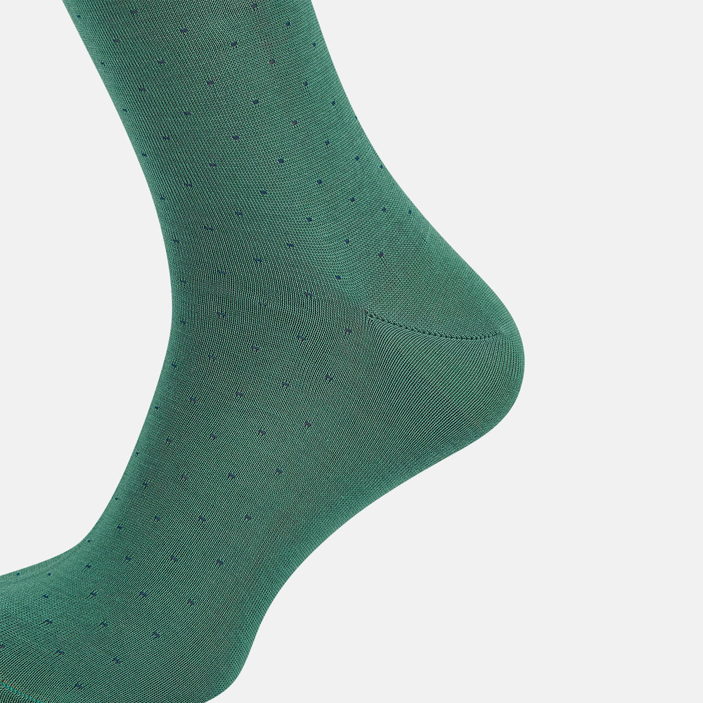 Turnbull & Asser's Forest Green/Navy Polka Dot Long Sock, made from mercerised Egyptian cotton, features a subtle dotted pattern and is shown against a plain white background.
