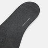 View 3 of product The Turnbull & Asser Steel/midnight Polka Dot Long Sock is shown in dark gray over the calf, displayed from the side on a white background with downward toe and ribbed top for a snug fit.