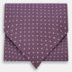 The Lilac and Violet Micro Dot Silk Cravat by Turnbull & Asser features small white polka dots on elegant silk, expertly crafted for a refined look, and is shown against a white background.
